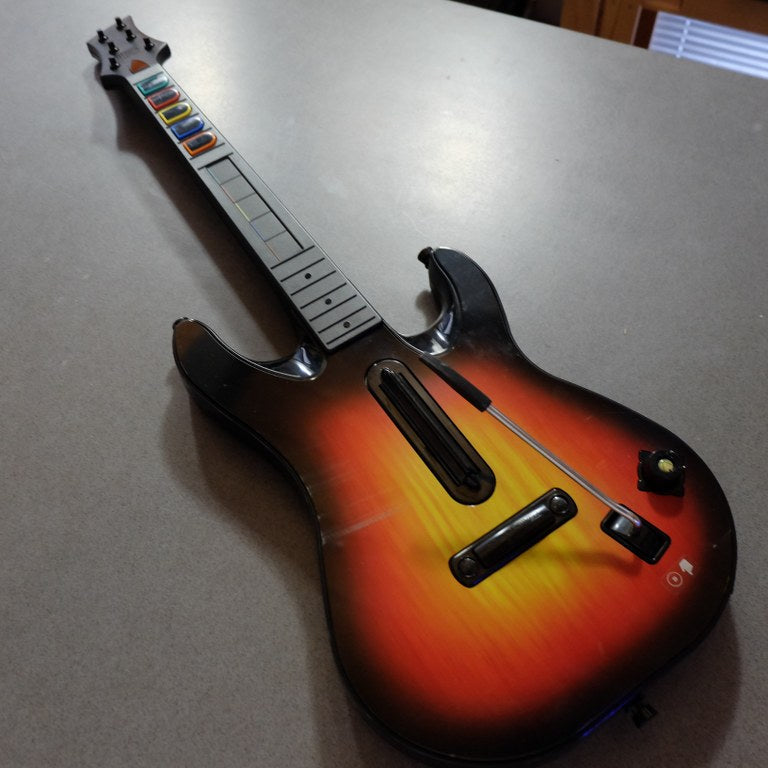 Blocco Giochi Guitar Hero/Rockband Microsoft